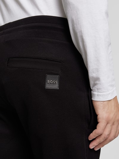 Peek & Cloppenburg BOSSSlim Fit Sweatpants mit Strukturmuster Modell 'Lamont' in black Speichern exportieren